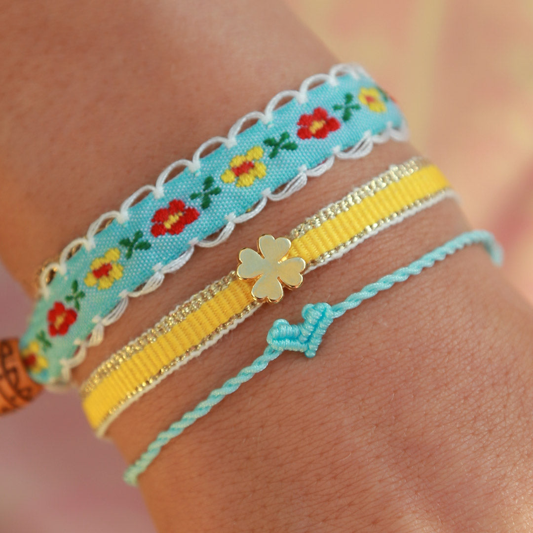 Woven bracelet clover yellow