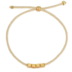 Le bracelet love doré beige