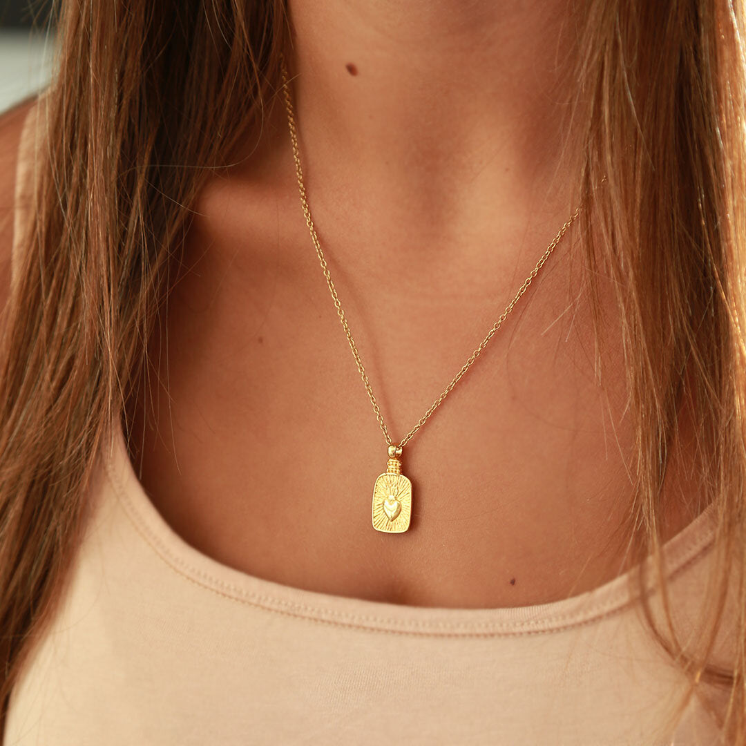 Gold necklace heart on fire