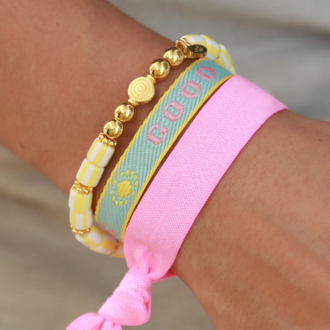 Geweven armbandje good vibes pastel